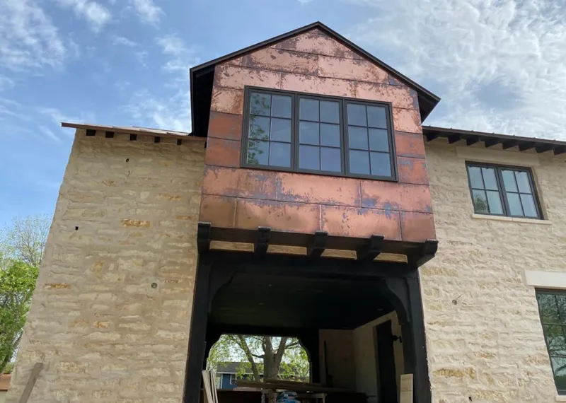 Copper metal panel facade on a stone building for Skylight Installation in Tyngsborough